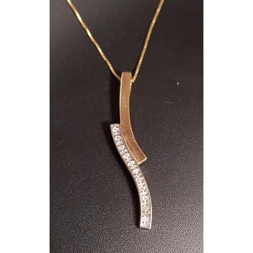 PRETTY DIAMOND SET PENDANT formed with two wavy sections, th...