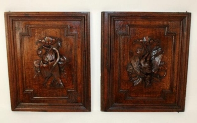 Pair of French carved oak panels with game