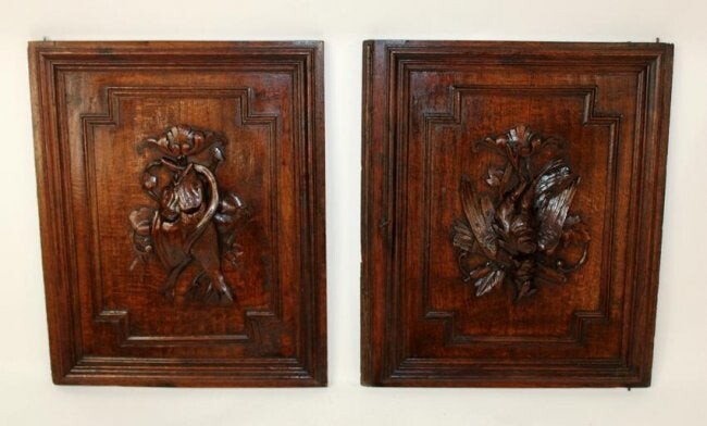 Pair of French carved oak panels with game