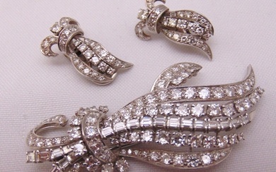 Platinum and diamond brooch and matching clip on earrings, a...