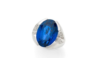 Ring in 18k white gold (750‰) adorned with an oval facetted tanzanite, approx. 18 carats, half