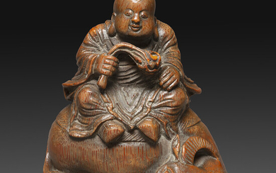 STATUETTE en bambou sculpt, reprsentant un enfant bouvier assis sur...