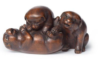 SUGUNOYA SHOKO A Wood Okimono (Table Ornament) of Three Puppie...