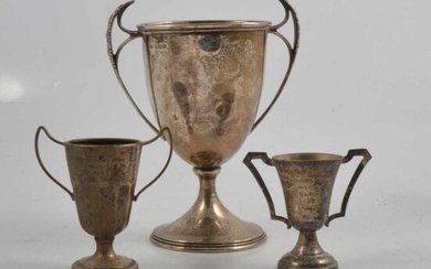 Silver two-handled trophy cup, Stevenson & Law, Sheffield 1917, and two small plated trophy cups.