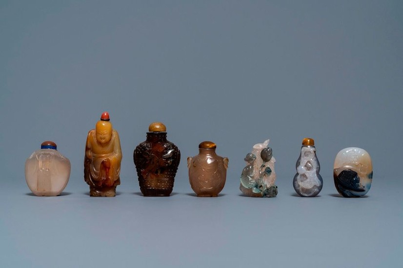 Six Chinese carved agate snuff bottles and a...