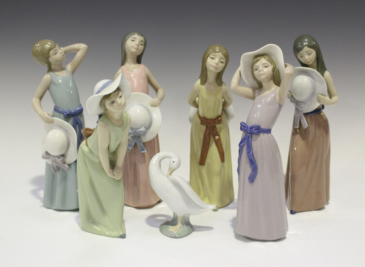 Six Lladro porcelain figures of young women with hats, including Naughty Girl, No. 5006, Bashful, No