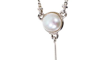 Tanzanite diamond and cultured pearl pendant necklace with a pear cut tanzanite measuring approximately 7 x 5mm suspended from a brilliant cut diamond and a cultured pearl in 18ct white gold settin...