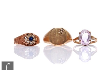 Three 9ct rings, a signet, a sapphire and paste and a single...