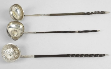 Three punch ladles, each with a baleen part twist stem