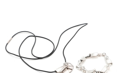 NOT SOLD. Toftegaard: A sterling silver "Stream" bracelet and pendant. Kautschuk rubber and sterling silver...