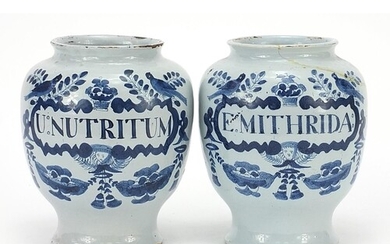 Two 18th century Delft blue and white tin glazed drug jars, ...