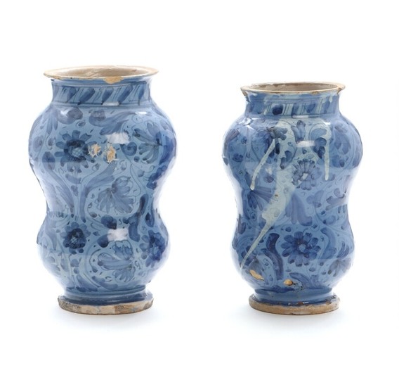 Two 18th century Italian faience apothecary jars. H. 21 and 22 cm. (2)