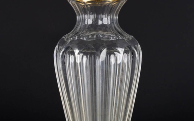 Un vase en cristal avec un anneau en argent plaqué or par Wolfers Frères. A835....