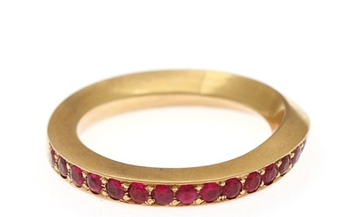 A ruby ring set with numerous circular-cut rubies, mounted in 18k gold. Size 58.