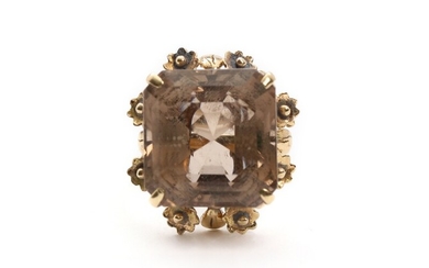 A smoky quartz ring set with with an emerald-cut smoky quartz, mounted in 8k gold. Size 56.5. Weight app. 12 g.