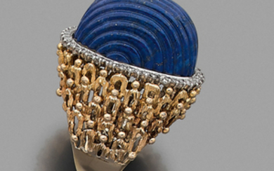 CIRCA 1970 LAPIS LAZULI RING A lapis lazuli, diamond and...