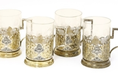 Four gilt white metal cup holders