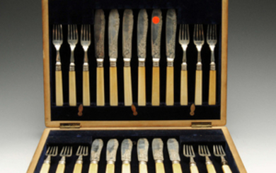 A matched Edwardian cased set of twelve silver and ivory handled fish knives and forks.