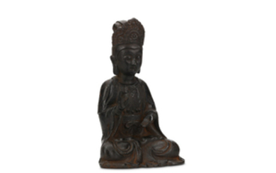 A CHINESE CAST IRON SEATED GUANYIN Ming Dynasty....