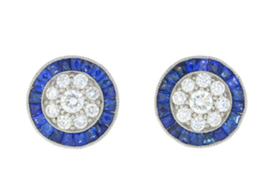 A pair of diamond and sapphire cluster earrings.