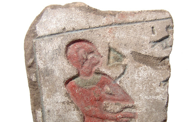 Egyptian sandstone relief fragment with pigment
