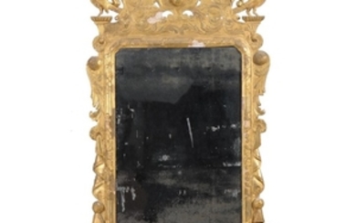 A George II giltwood and composition wall mirror, second quarter 18th century