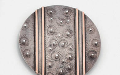 JEAN DESPRES CIRCA 1940 BROOCH A round-shaped silver...