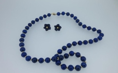 A lapis lazuli bead necklace together with a pair of