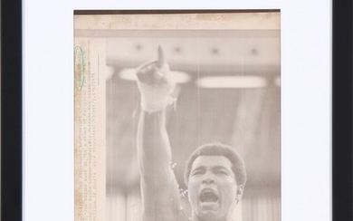 Muhammad Ali (1942–2016) before his fight against Joe Bugner (b. 1950) in Kuala Lumpur in the summer of 1975. Original American black-and-white press photo.