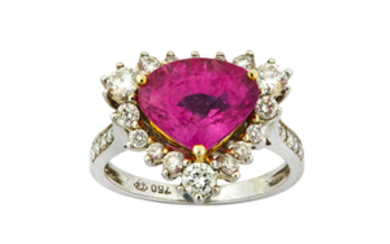 A pink sapphire and diamond ring The triangular-cut...
