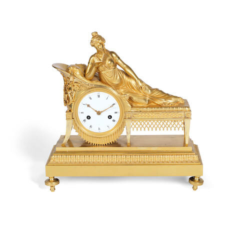 A 19th century French gilt bronze figural mantel clock in the Empire taste