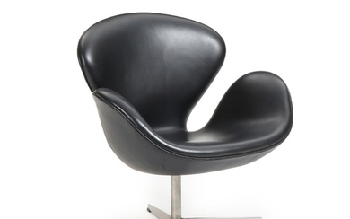 Arne Jacobsen: “The Swan”. Lounge chair upholstered with black leather, on aluminium star base. Manufactured by Fritz Hansen in 2001.