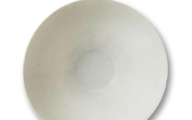 A WHITE-GLAZED ANHUA-DECORATED 'DRAGON' BOWL