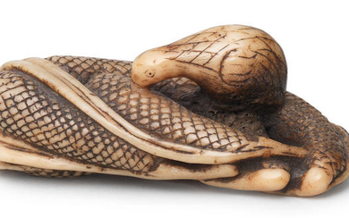 An ivory netsuke of a quail on millet