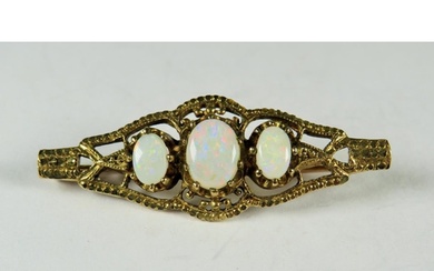 9ct Yellow Gold Bar Brooch set with Three oval Opals with go...