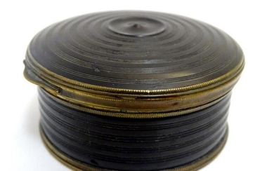 A 19thC snuff box of circular form with turned