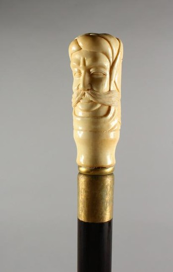 A BONE HANDLED WALKING STICK, carved as a bust of a