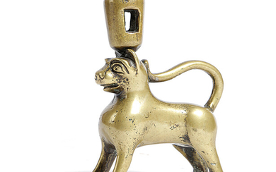 A BRONZE CANDLESTICK IN THE FORM OF A LION OR LEOPARD