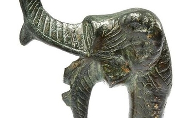 A BRONZE ELEPHANT SPOUT TERMINAL, PERSIA OR CENTRAL ASIA, 11TH-12TH CENTURY