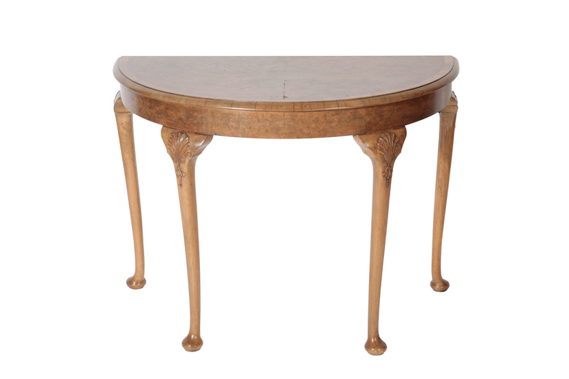 A BURR WALNUT AND FEATHER BANDED DEMI-LUNE SIDE TABLE IN GEORGE II STYLE