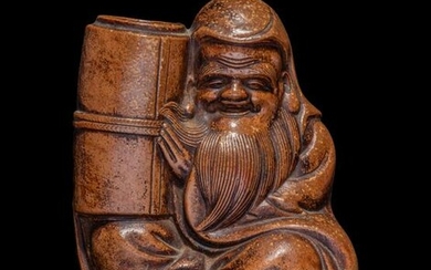 A Bronze Figure of a Seated Immortal