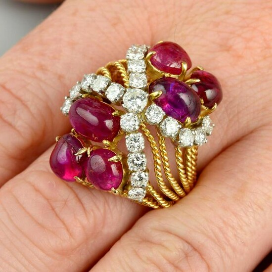 A Burmese ruby cabochon and diamond dress ring.With