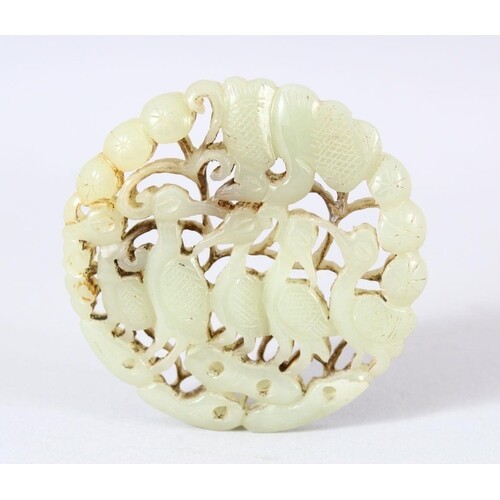A CHINESE CARVED JADE DISK // PENDANT - Carved with birds as...
