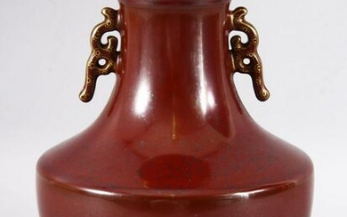 A CHINESE PORCELAIN RED GROUND BALUSTER FORM VASE, with