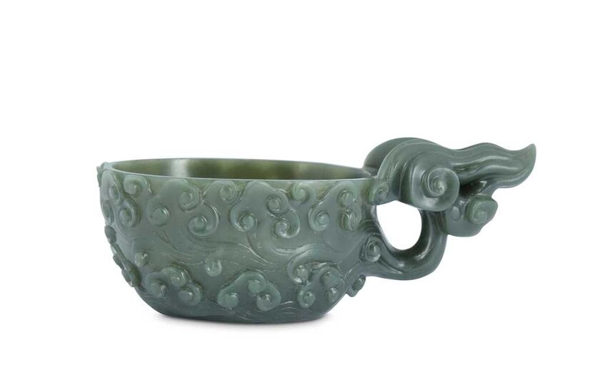 A CHINESE SPINACH-GREEN JADE ARCHAISTIC POURING VESSEL.