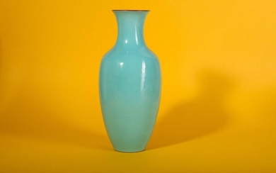 A CHINESE TURQUOISE-GLAZED VASE. Early 20th Century. With an ovoid body and a flared rim decorated with a bright turquoise glaze, the interior of the rim and underside glazed pink and bearing a six character Qianlong mark, the rims picked out with...