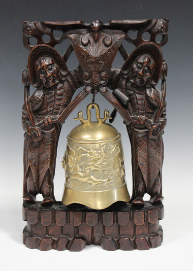 A Chinese hardwood table bell stand and brass bell, early 20th century, the stand carved and pierced