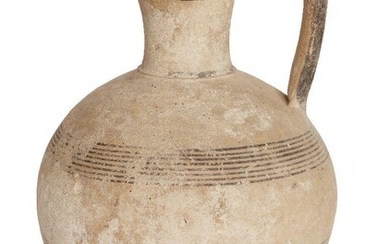A Cypriot Iron Age Bichrome Ware amphora with pinched-in lip, the body decorated with two groups of encircling banded decoration, circa 750-475 B.C., 26cm high Provenance: The Estate of costume designer Anthony Powell (1935-2021)