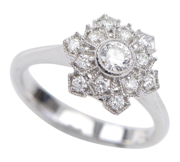 A DIAMOND DRESS RING - Of snowflake design, set with round brilliant cut diamonds totalling 0.51cts, in 18ct white gold, ring size N.