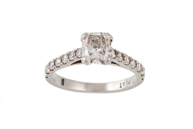 A DIAMOND SOLITAIRE RING, with cushion cut centre stone of a...